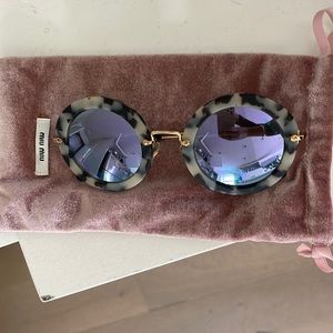 MIU MIU Round reflective tortoise sunglasses